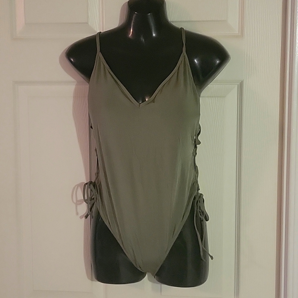 New without tags. Never worn 1 piece camo green swim suit. L